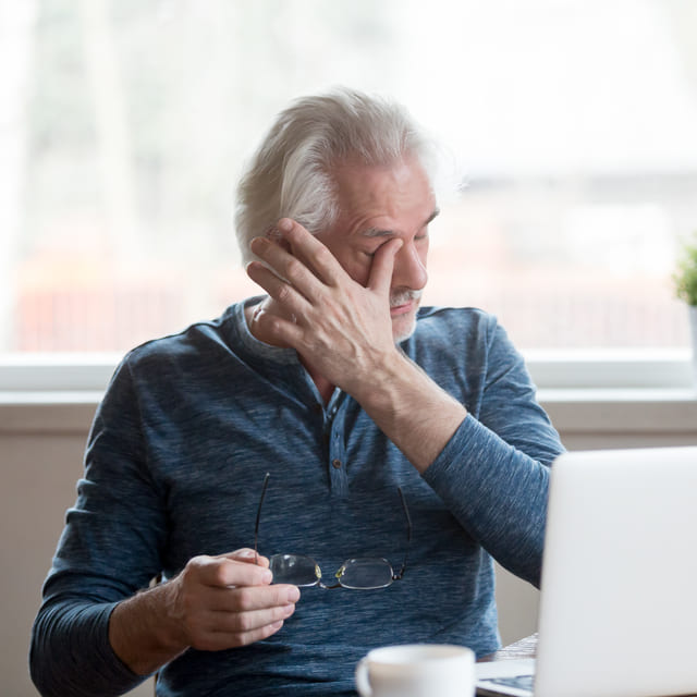 senior man suffering from dry eyes